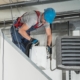 Professional working on HVAC unit