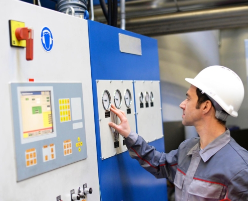 worker looking at building equipment