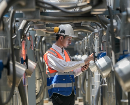 worker looking over building automation system